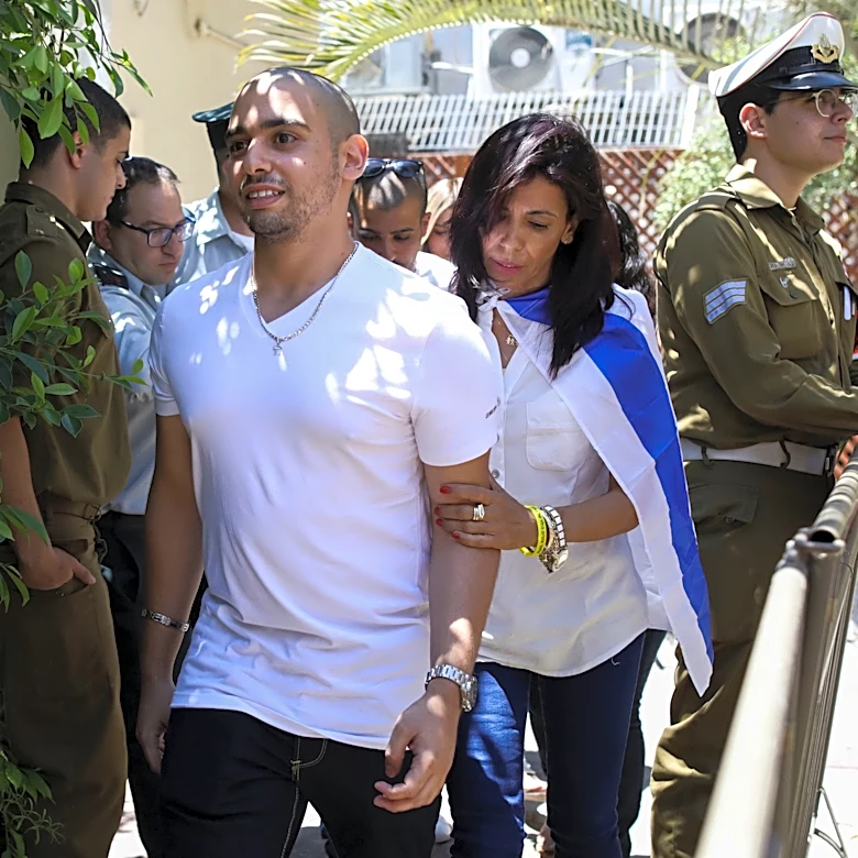 Israel's president pardons a combat medic whose shooting of a Palestinian attacker caused debate