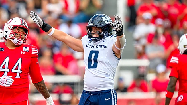 Utah State's Taggart leaves field in an ambulance; in concussion protocol and has a neck injury
