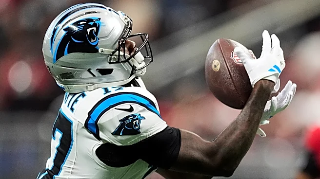 Young throws 3 TD passes, including 2 to Waller, as Panthers dominate short-handed Falcons 34-3