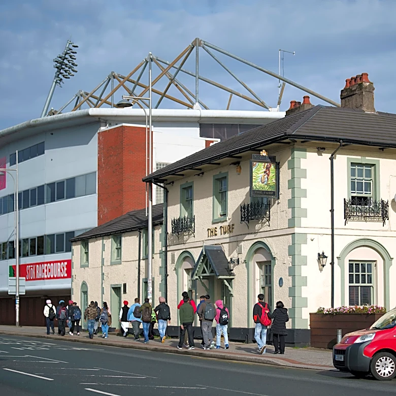 Cheers! Wrexham's celebrity owners buy 'The Turf' pub that's adjacent to the club's stadium