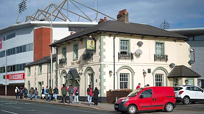 Cheers! Wrexham's celebrity owners buy 'The Turf' pub that's adjacent to the club's stadium
