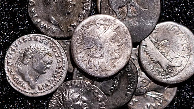 Amateur archaeologist finds Germany’s biggest hoard of ancient Roman silver coins