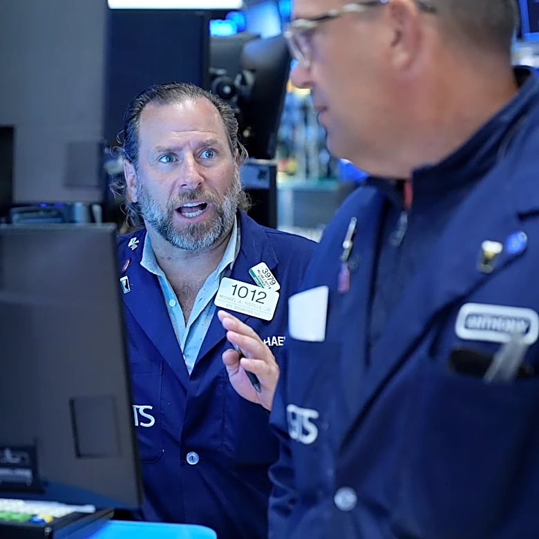 Wall Street holds near its record as Brent oil falls below $100 per barrel