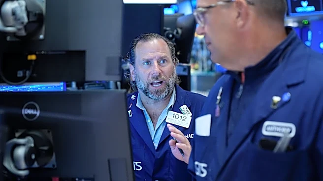 Wall Street holds near its record as Brent oil falls below $100 per barrel