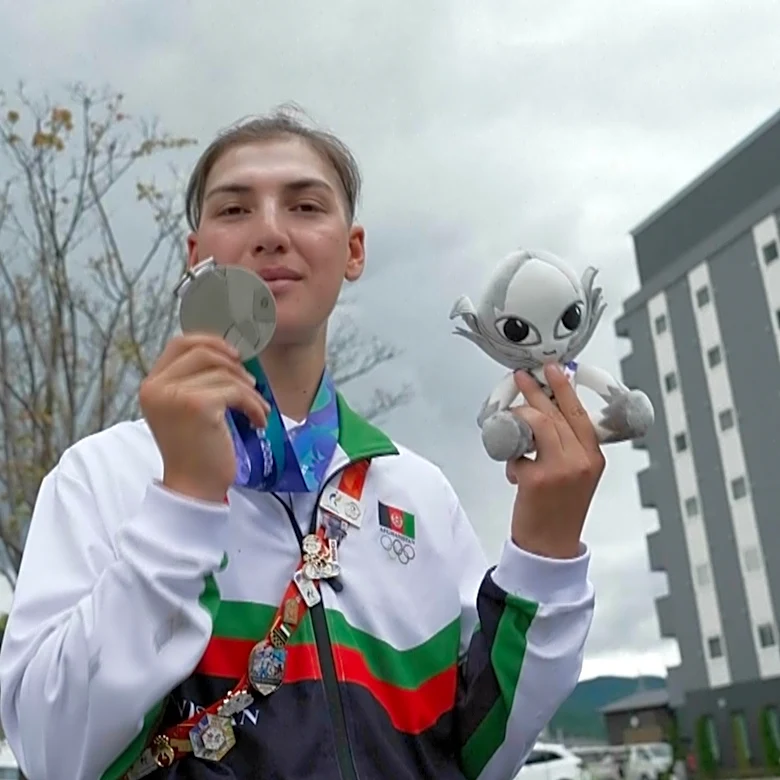 Afghan female cyclist wins silver at Asian Games after disguising herself as a man to train