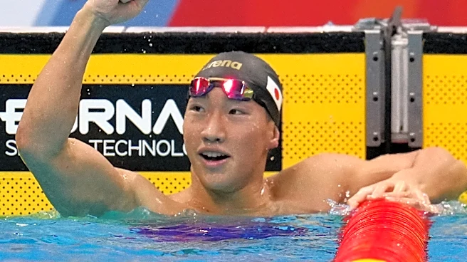 Shin Ohashi of Japan sets world record in 200-meter breaststroke at the Asian Games