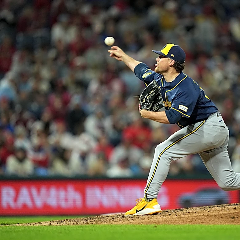 Brewers reach 100 wins for first time, slow Phillies' playoff push with 5-1 victory