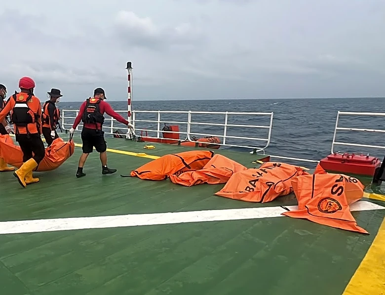 Divers recover a total of 52 bodies from capsized ferry in Indonesia after a dayslong search