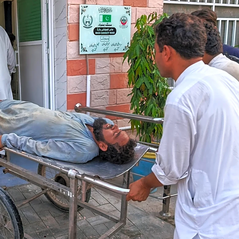 Gunmen target ambulance in Pakistan after suicide bombing at checkpoint killed 12