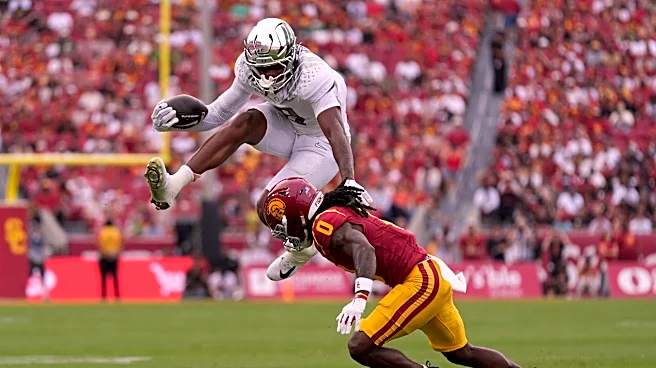 Dylan Raiola leads No. 20 Oregon past No. 12 USC 41-27 after Dante Moore's frightening injury
