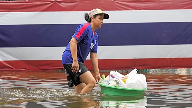 Rain eases in Bangkok but persistent flooding forces thousands to leave home