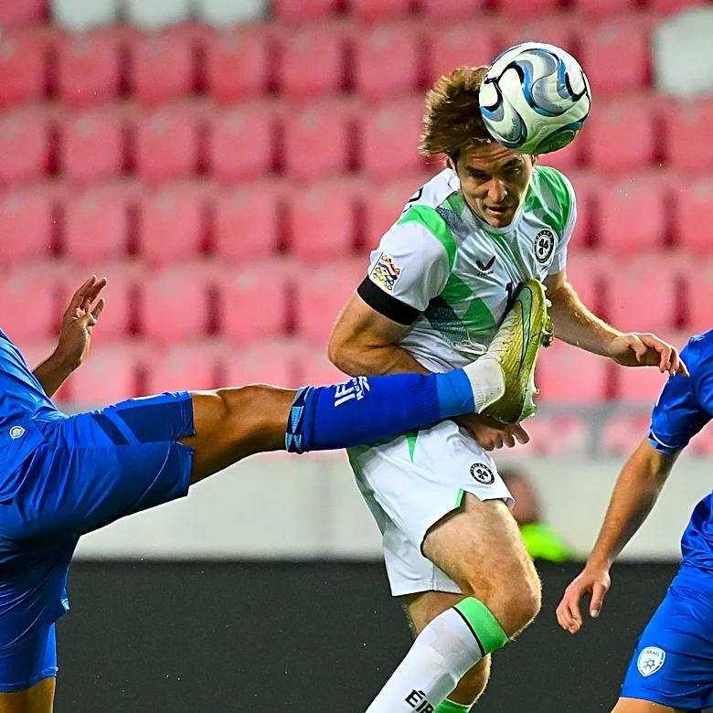 Ireland players wear black armbands and refrain from handshakes in soccer game against Israel