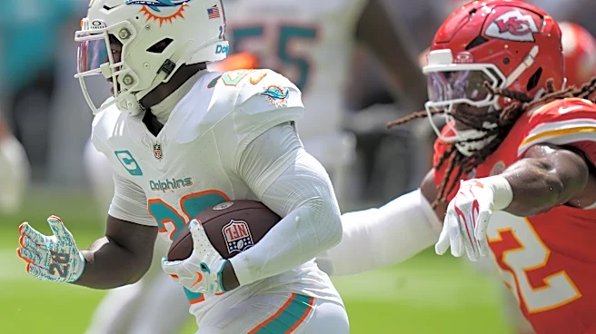Dolphins' star RB De'Von Achane hurts knee vs. Chiefs; team awaiting word on severity