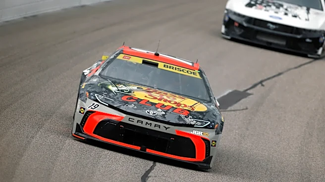 Kyle Larson passes Chase Briscoe with 7 laps left to win for the fourth time at Kansas Speedway