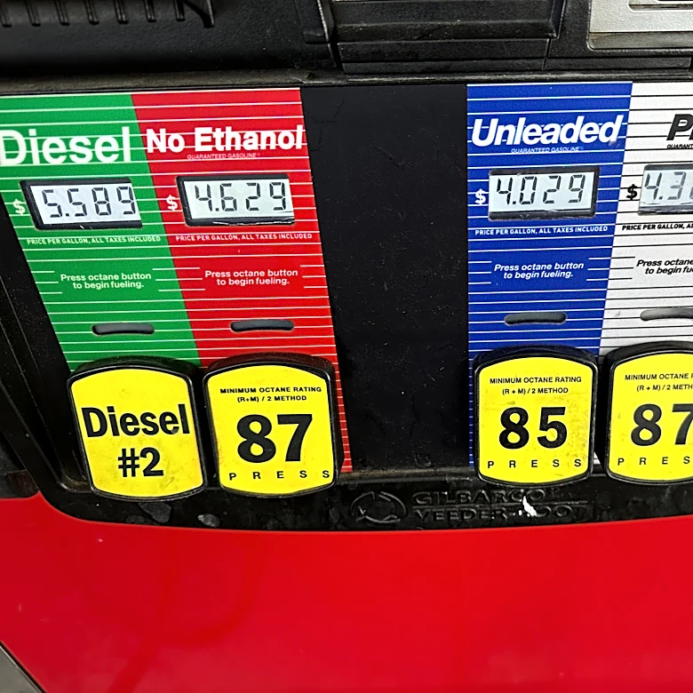 Inflation cooled slightly last month even as consumers stepped up spending