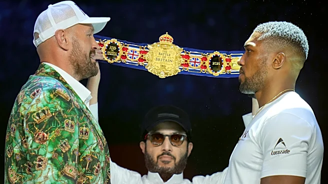 Fury and Joshua are mostly smiles as they take stage together ahead of Cardiff bout