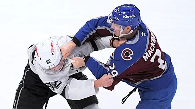MacKinnon has 2 goals and a rare fight in the Avs' 8-4 victory over the Kings in opener