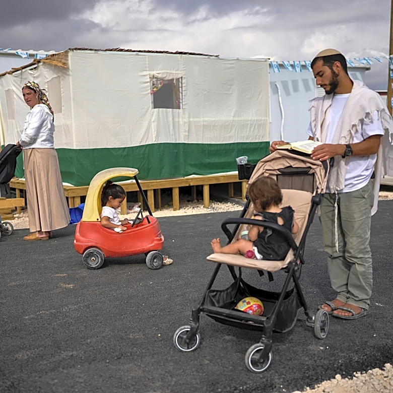 Photos show Israeli settlers celebrating settlement expansion in the occupied West Bank