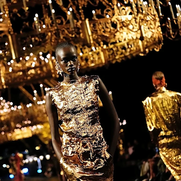 Paris fashion defies a bruised luxury industry with J.Lo, golden glamour and skimpy outfits