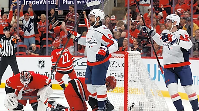 Tuch scores twice in his first game for Washington, helping the Capitals beat the Hurricanes 5-2