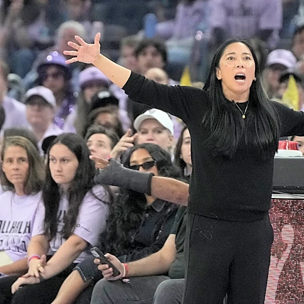 Valkyries coach Nakase goes down on sideline late in Golden State's playoff-clinching win over Wings