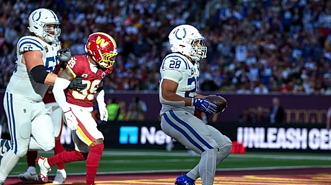 Taylor runs for 2 TDs and Colts beat Commanders 30-13 in London