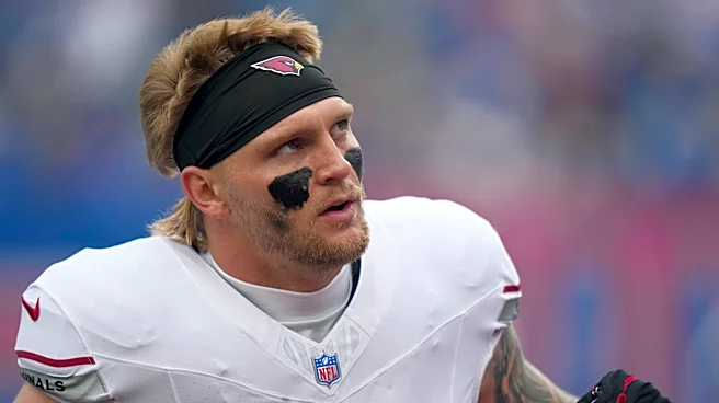 NFL says it is looking into an official cursing at Cardinals tight end Trey McBride