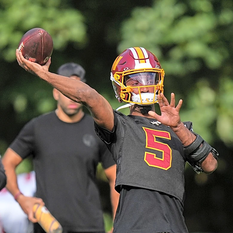 Jayden Daniels pledges to 'embrace the brace' on left arm as Commanders QB returns to practice
