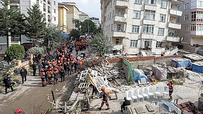 A partial building collapse in Istanbul kills 2 and traps at least 2 more