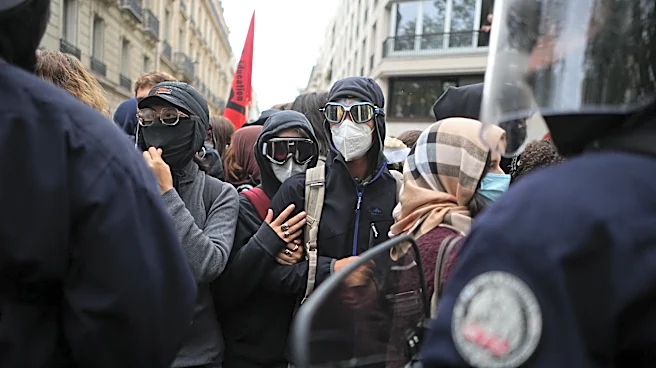 Police fire tear gas at a barricaded high school in Paris as school protests show no sign of ending