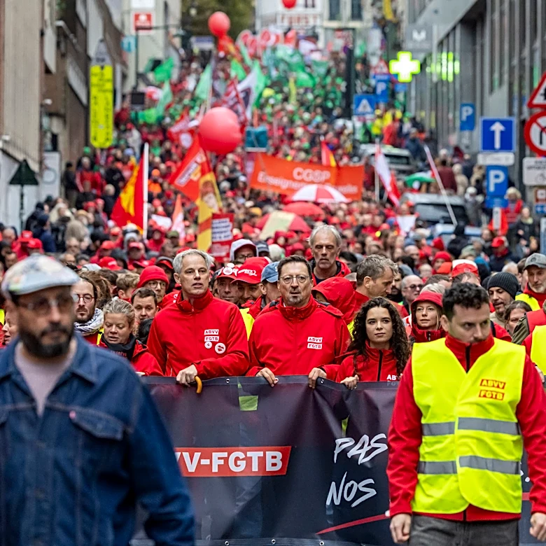 Police and masked protesters clash in Brussels as anti-austerity rally disrupts city