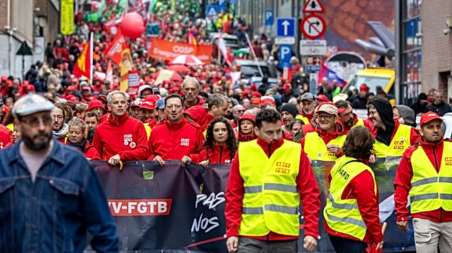 Police and masked protesters clash in Brussels as anti-austerity rally disrupts city
