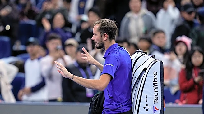 Medvedev advances at Shanghai in 1st match since disqualification. Mustached Alcaraz wins opener