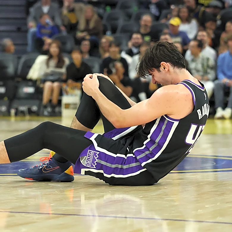 Kings center Maxime Raynaud taken off court in wheelchair after going down with right knee injury