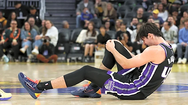 Kings center Maxime Raynaud taken off court in wheelchair after going down with right knee injury