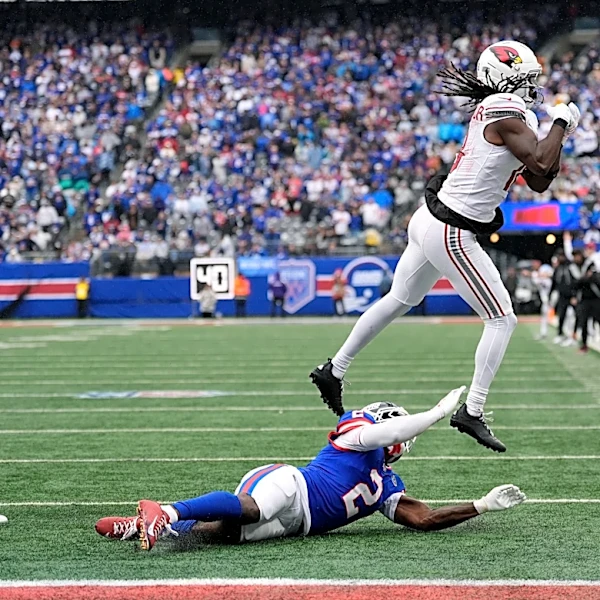 Cardinals end bizarre week by trading Harrison, getting thumped by Lions