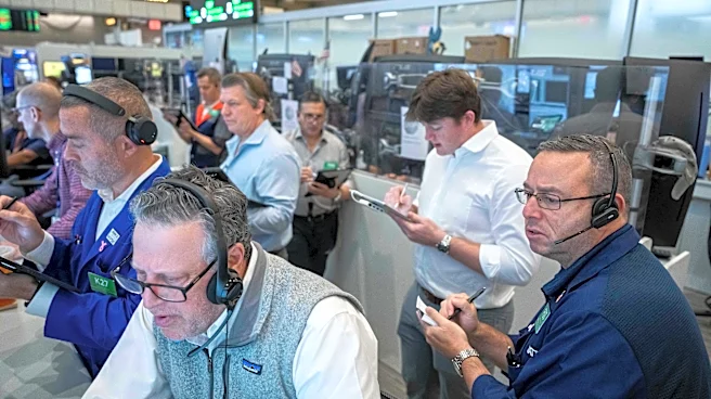 US stocks hover near their latest record in mixed trading on Wall Street
