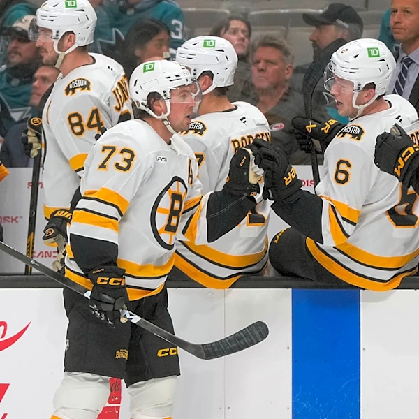 McAvoy scores in his 1st game back from a suspension to lead the Bruins past the Sharks 6-3