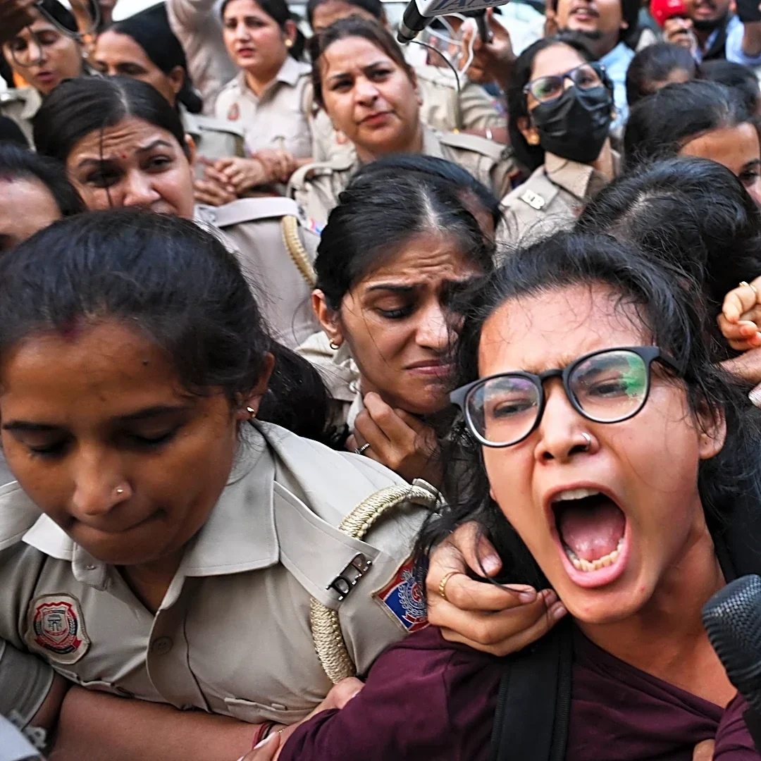 Crowds throng New Delhi and wave Indian flags amid escalating protests