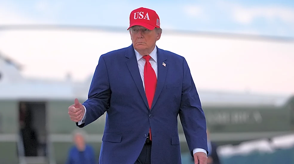 Trump puts new Russia sanctions passed by Congress on hold, saying waiver is in US national interest