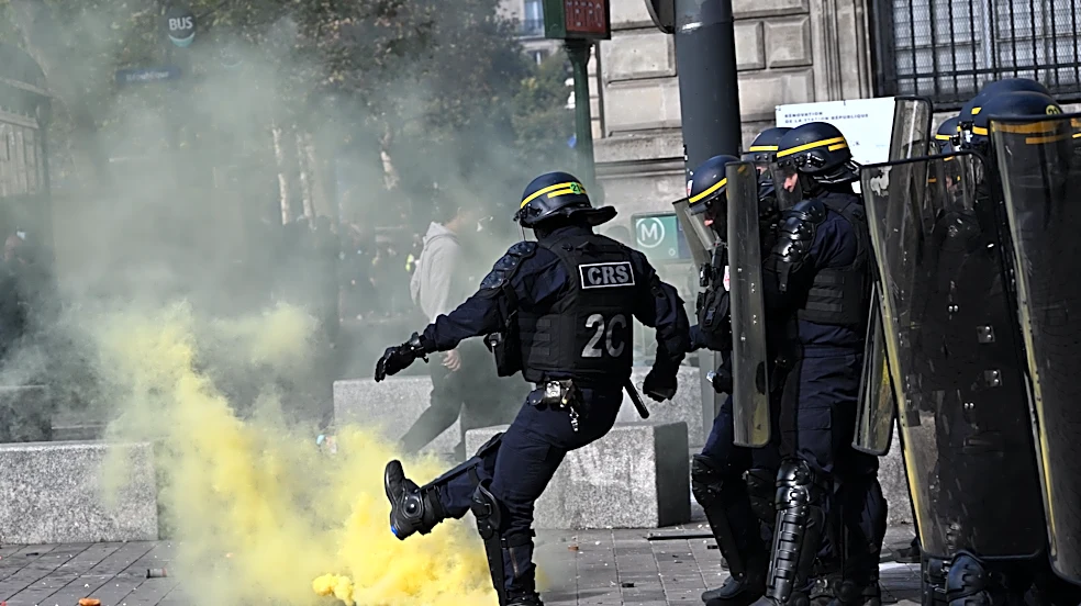 Scuffles and fires break out as protesters rally across France, joining students