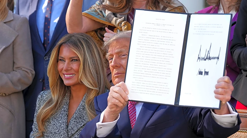 Trump signs an order aimed at boosting women's health research, a plan backed by the first lady
