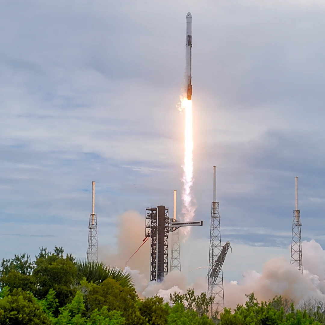 Elon Musk's SpaceX reports a profit and he hints at a possible merger with Tesla