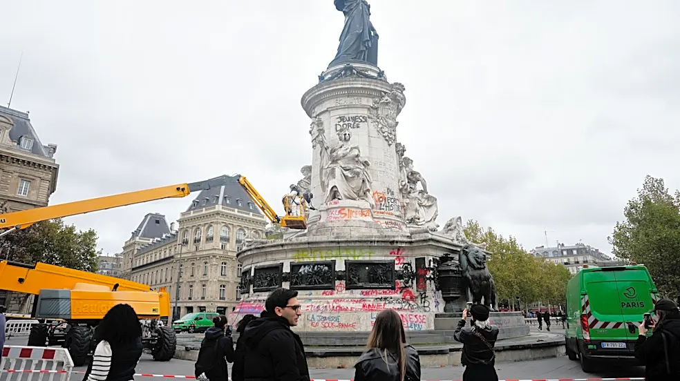 Thousands gather in Paris after a court lifts a protest ban despite fears of new violence