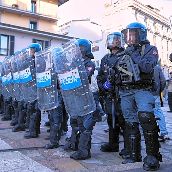 Soldiers guard center of Milan as thousands of protesters march in cities across Europe