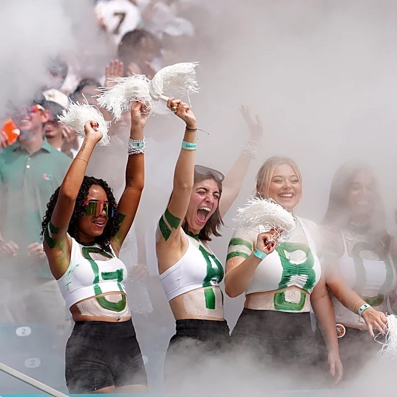 No. 1 Miami, in its first game atop AP poll since 2002 season, rolls past Pitt 52-23