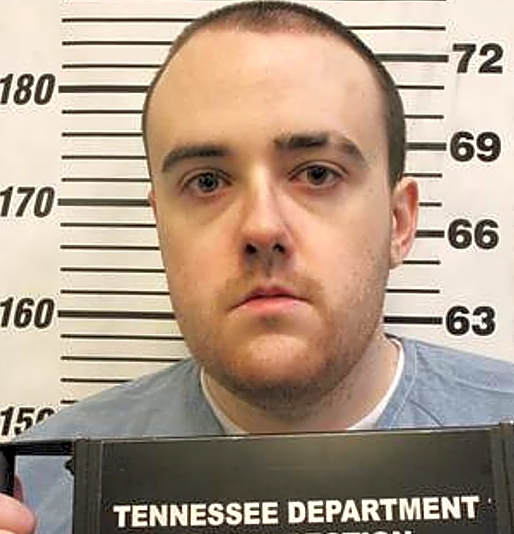 Man serving a life sentence for murder slips through a fence and escapes a Tennessee prison