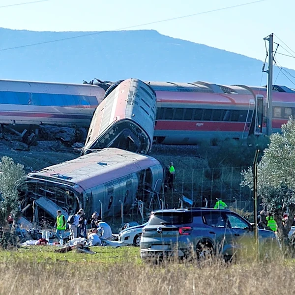 High-speed train hits stopped train in central Spain, killing at least 10