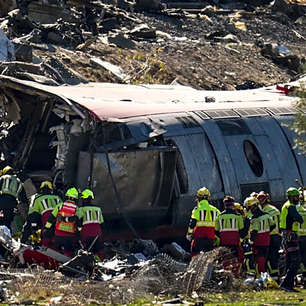 At least 30 dead in crash between 2 trains in central Spain