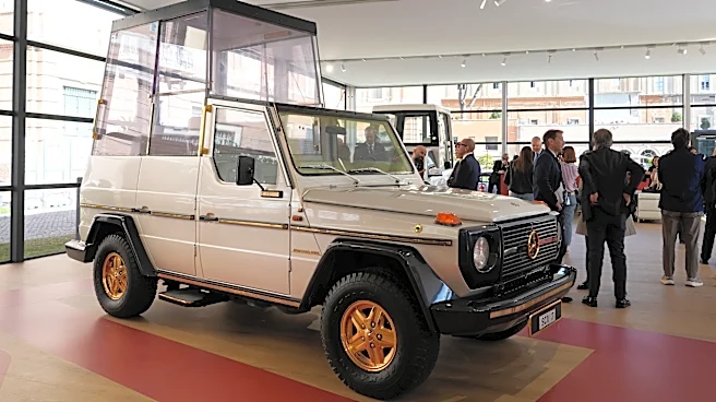 A popemobile exhibition is unveiled at the Vatican, featuring the vehicle popes have used since 1930